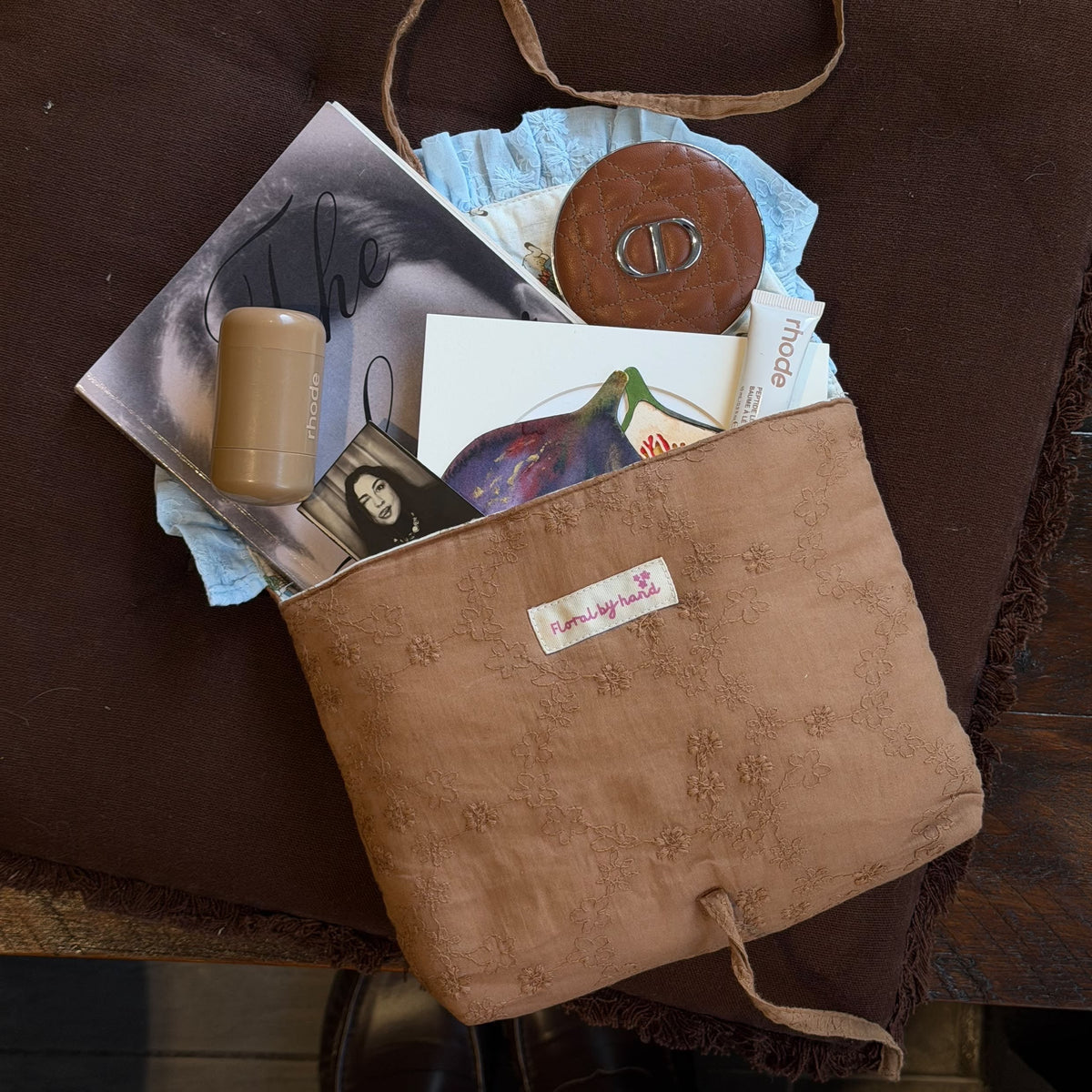 Handmade brown quilted letter pouch with baby blue ruffles and floral lace embroidery, available as a cosmetic pouch, A5 book sleeve and padded iPad sleeve.