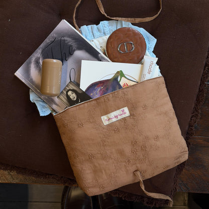 Handmade brown quilted letter pouch with baby blue ruffles and floral lace embroidery, available as a cosmetic pouch, A5 book sleeve and padded iPad sleeve.