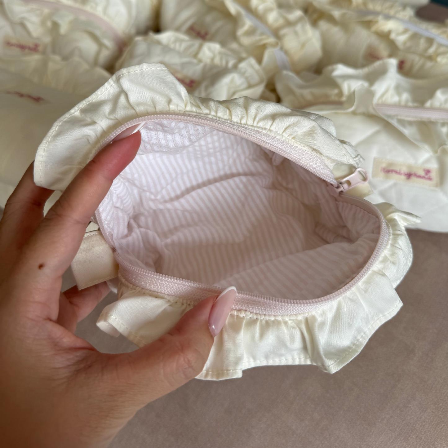 handmade soft quilted pastel pink yellow butter cream white green sage turquoise cosmetic pouch with personalized embroidery name customization ruffles pinterest aesthetic coquette ballerina core makeup bag beauty case vanity girly feminine minimalism princess barbie bridesmaids gift ideal outfit 