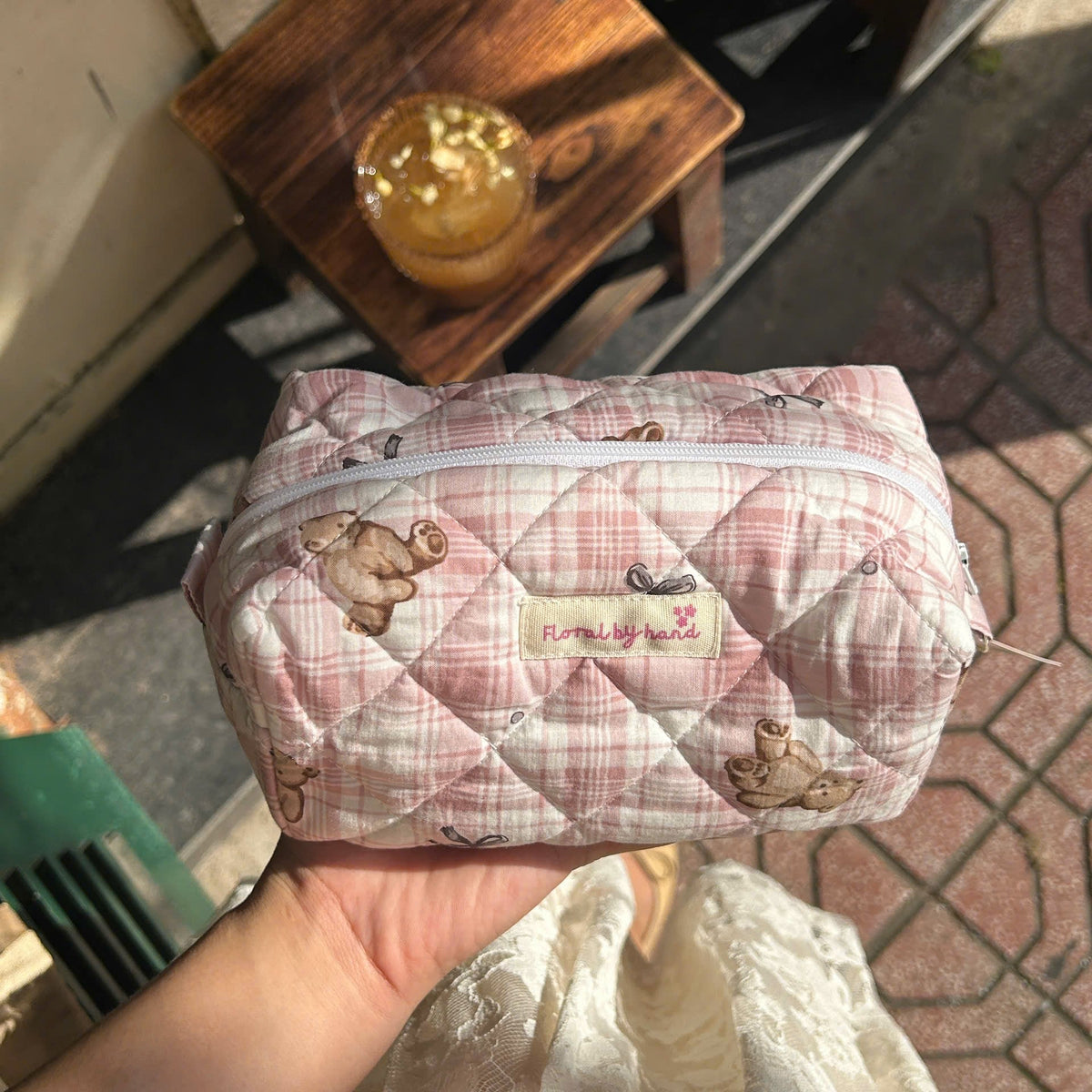 Medium pink teddy bear quilted makeup pouch with zipper and black bow print
