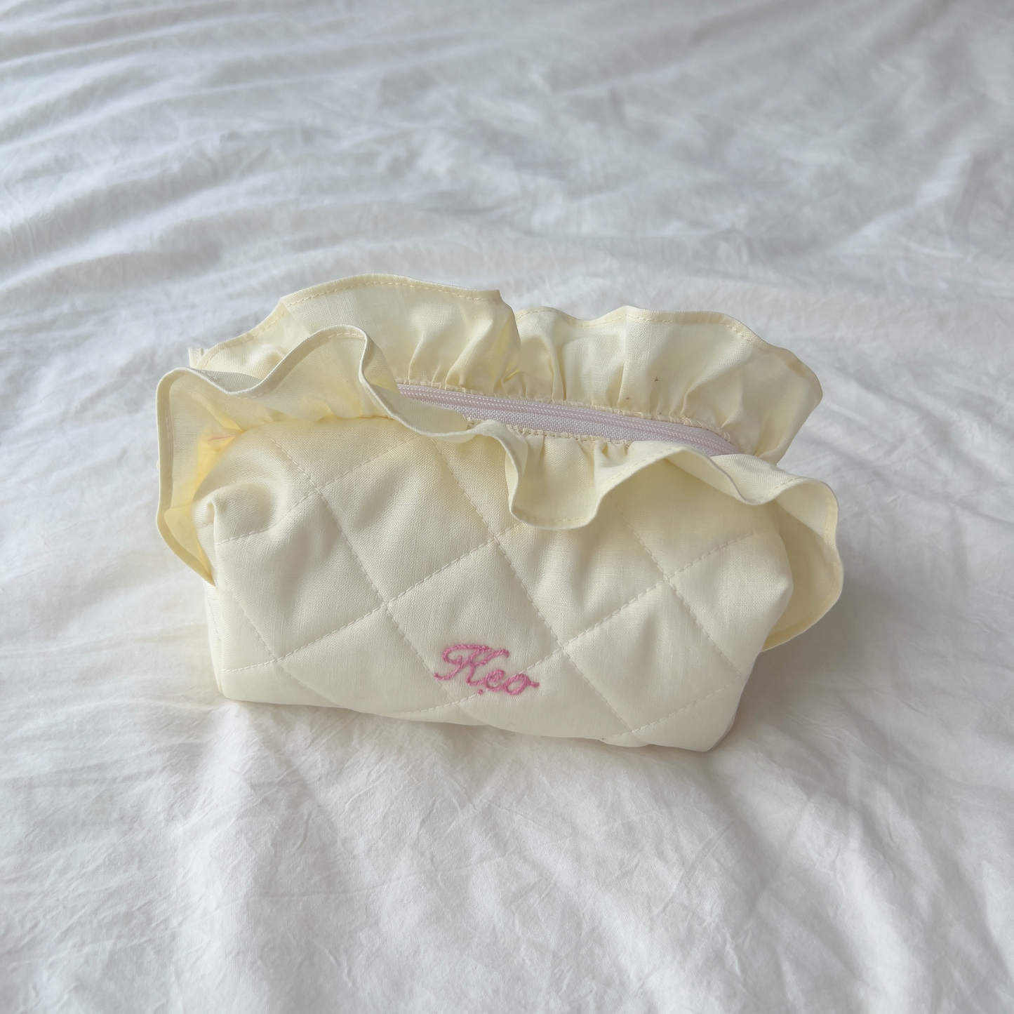 handmade soft quilted pastel pink yellow butter cream white green sage turquoise cosmetic pouch with personalized embroidery name customization ruffles pinterest aesthetic coquette ballerina core makeup bag beauty case vanity girly feminine minimalism princess barbie bridesmaids gift ideal outfit 