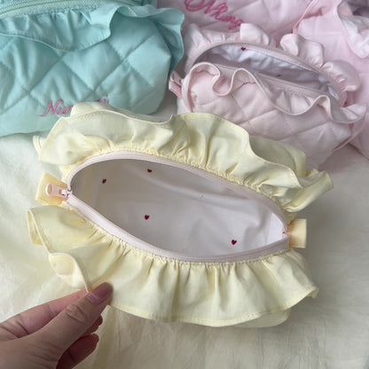 handmade soft quilted pastel pink yellow butter cream white green sage turquoise cosmetic pouch with personalized embroidery name customization ruffles pinterest aesthetic coquette ballerina core makeup bag beauty case vanity girly feminine minimalism princess barbie bridesmaids gift ideal outfit 